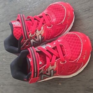 New Balance red athletic shoes